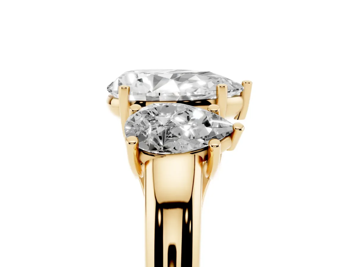 Three-Stone Pear Cut Diamond Engagement Ring with Prong Setting Yellow gold