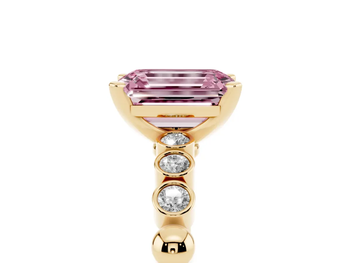 Fancy Pink Emerald Cut Solitaire Bezel Accent Diamond Engagement Ring with Beaded Band and Four-Prong Setting Yellow gold