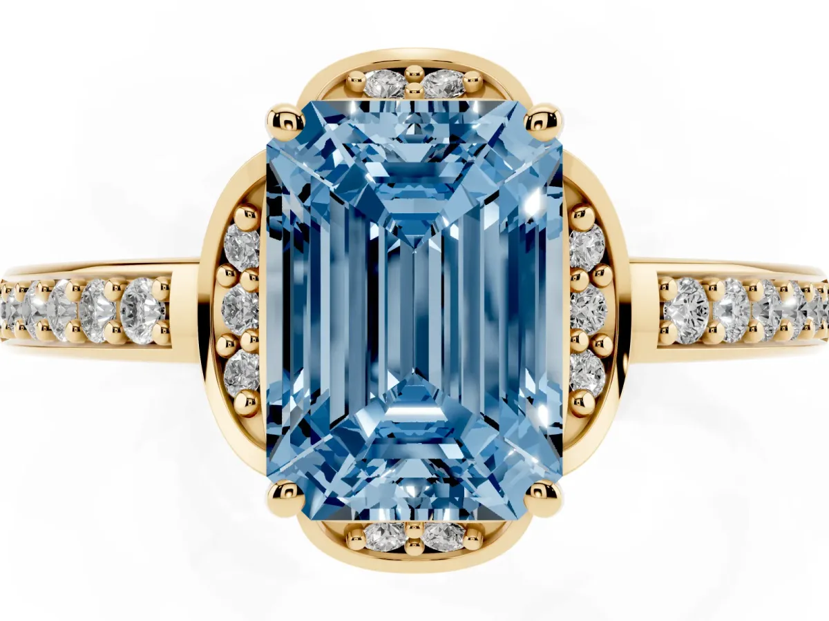 Fancy Blue Emerald Cut Cut Halo Diamond Ring with Channel Set Band and Four-Prong Setting Yellow gold