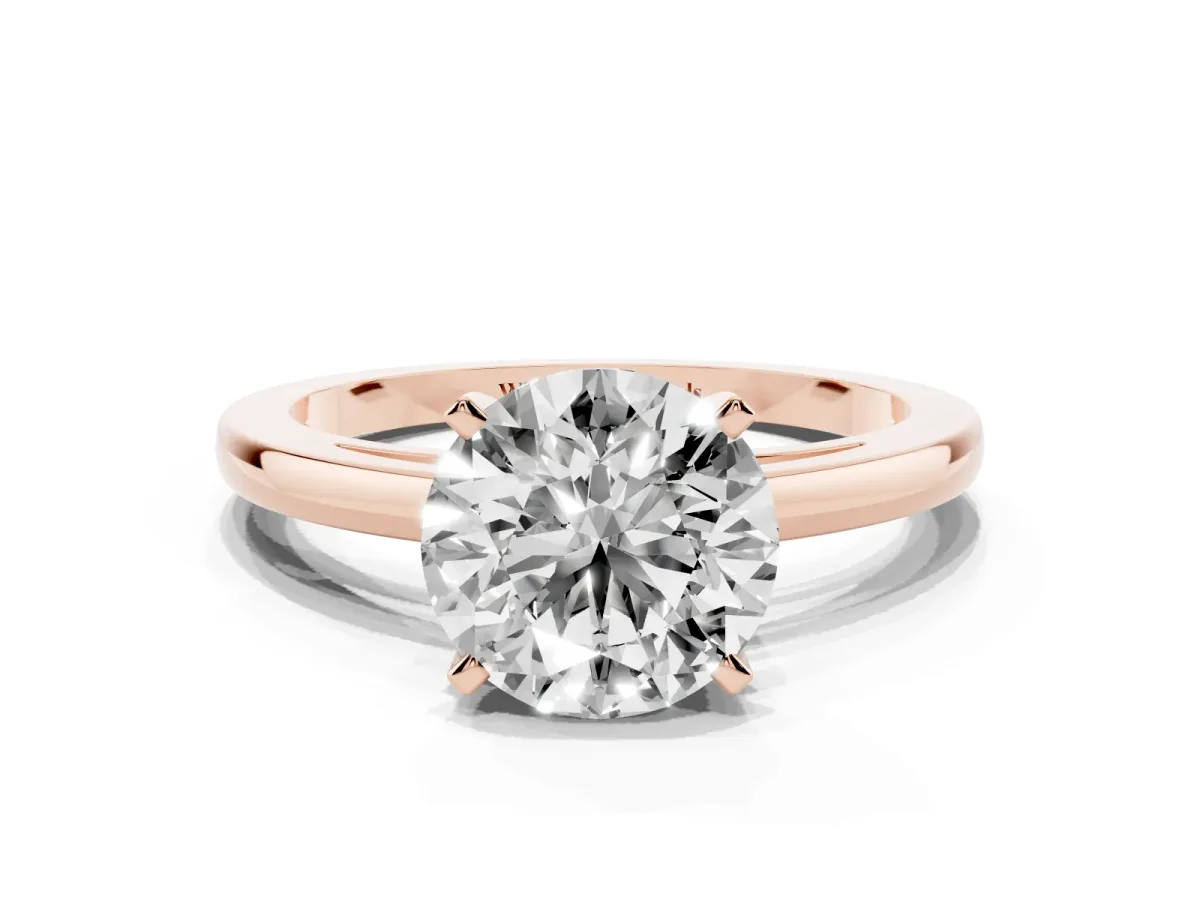 Round Cut Solitaire Diamond Engagement Ring with Four-Prong Setting on a Classic Band Rose gold