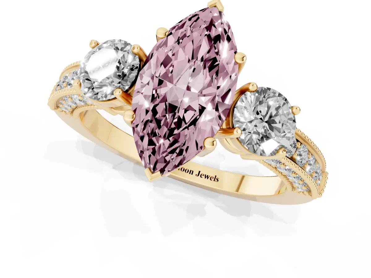 Fancy Pink Marquise Cut Three-Stone Diamond Ring with Pavé Band and Four-Prong Setting Yellow gold