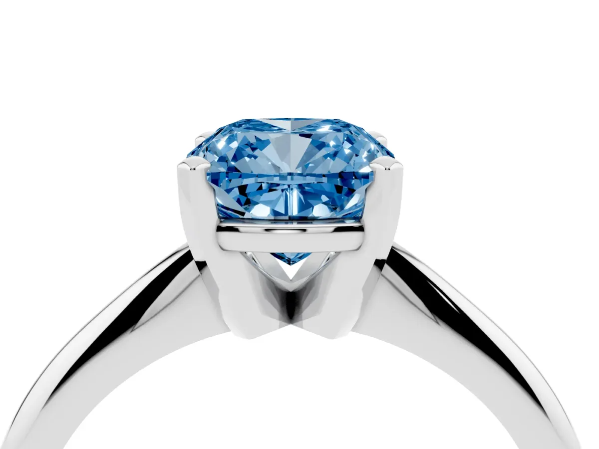 Fancy Blue Cushion Cut Cut Solitaire Ring with Four-Prong Setting on a Classic Band Silver