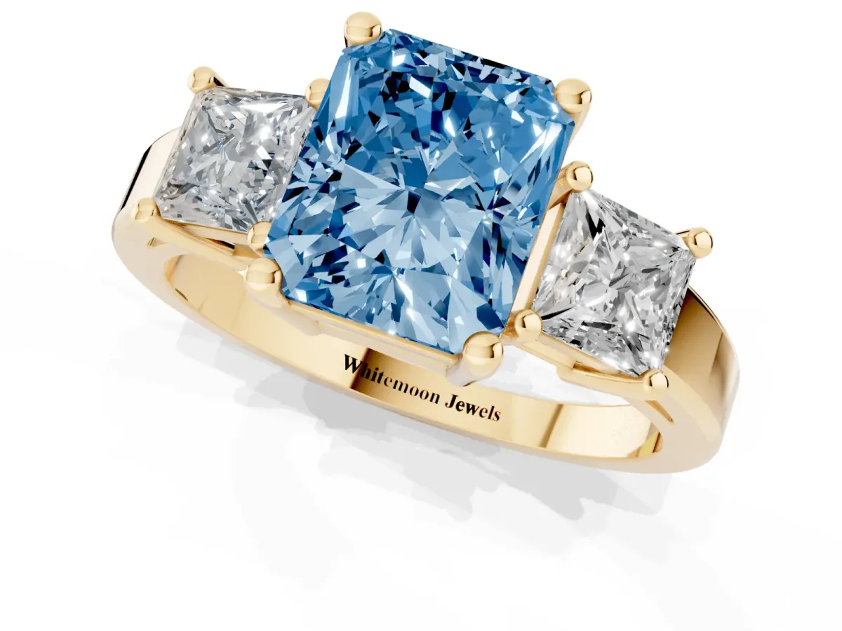 Fancy Blue Three-Stone Radiant Cut Cut Solitaire Ring with Prong Setting Yellow gold