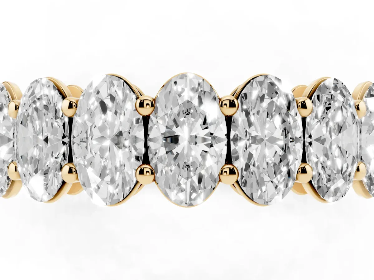 Oval Cut Diamond Eternity Band with Shared Prong Setting Yellow gold
