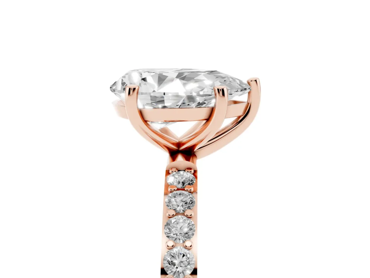 Pear Cut Diamond Solitaire Ring with Round Pavé Shoulders and Prong Setting Rose gold
