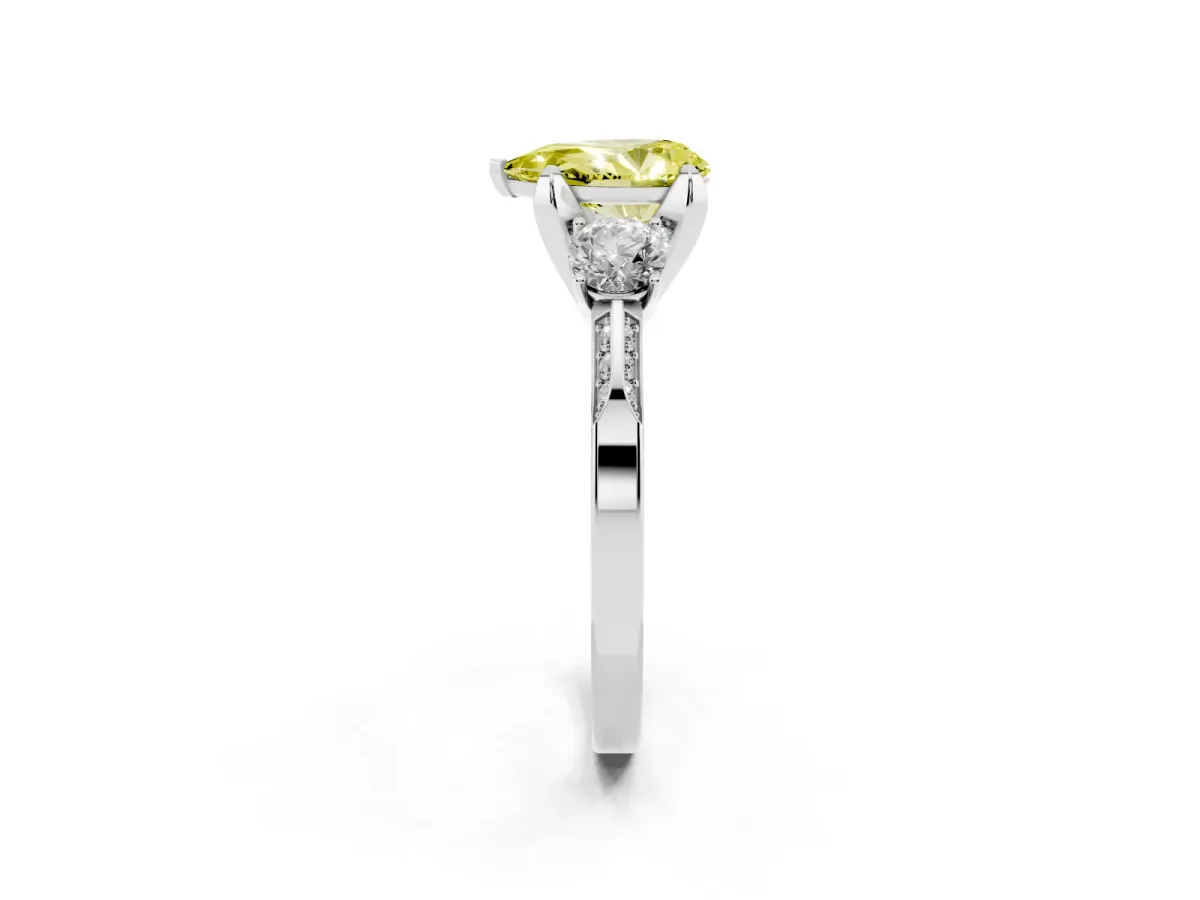 Fancy Yellow Pear Cut Brilliant Three-Stone Diamond Ring with Pavé Band and Four-Prong Setting Platinum