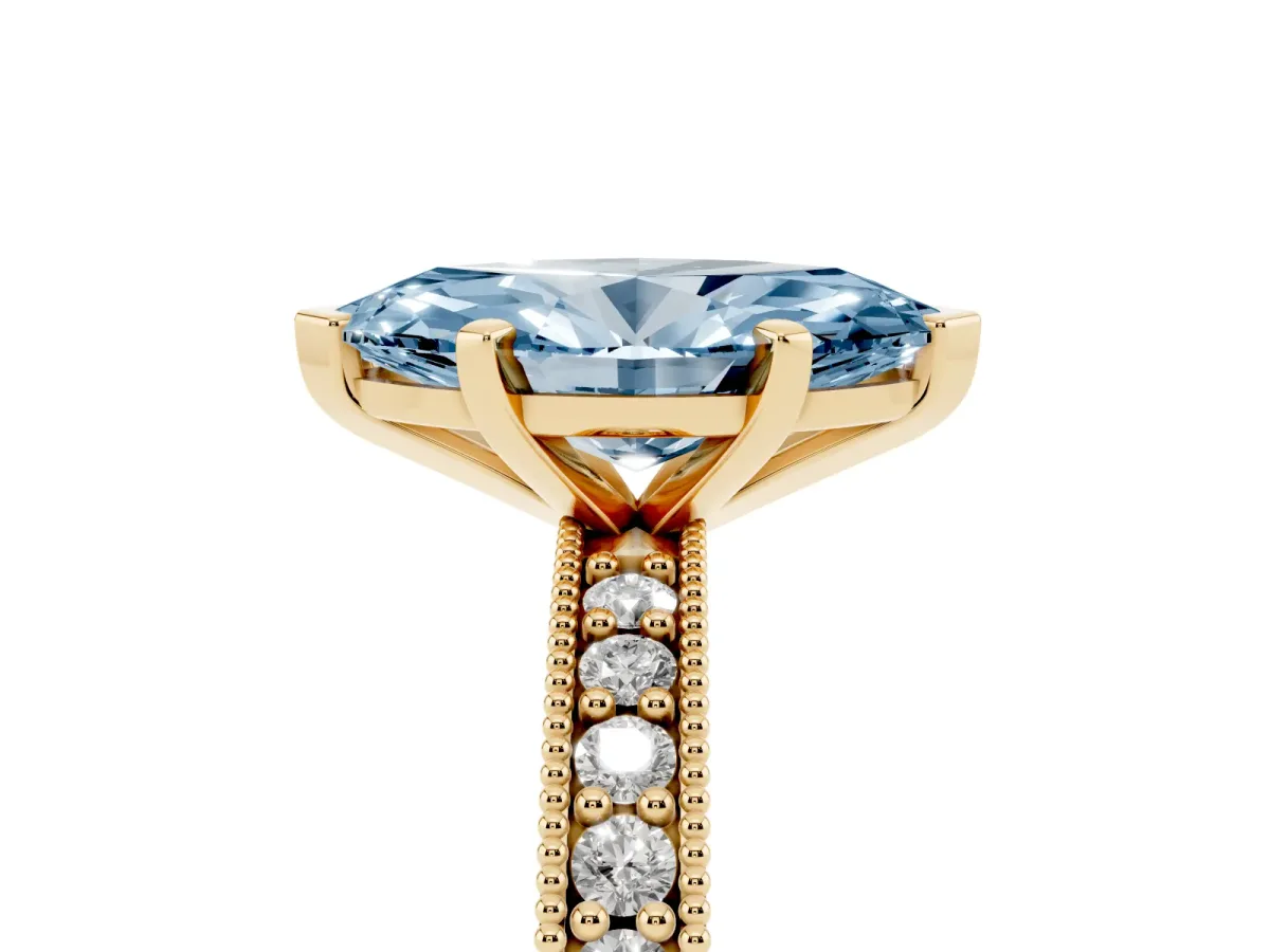 Fancy Blue Marquise Cut Diamond Milgrain Pavé Engagement Ring with Four-Prong Setting Yellow gold