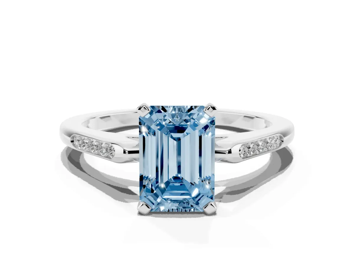 Fancy Blue Emerald Cut Diamond Solitaire Ring with Channel Set Round Band and Prong Setting Silver