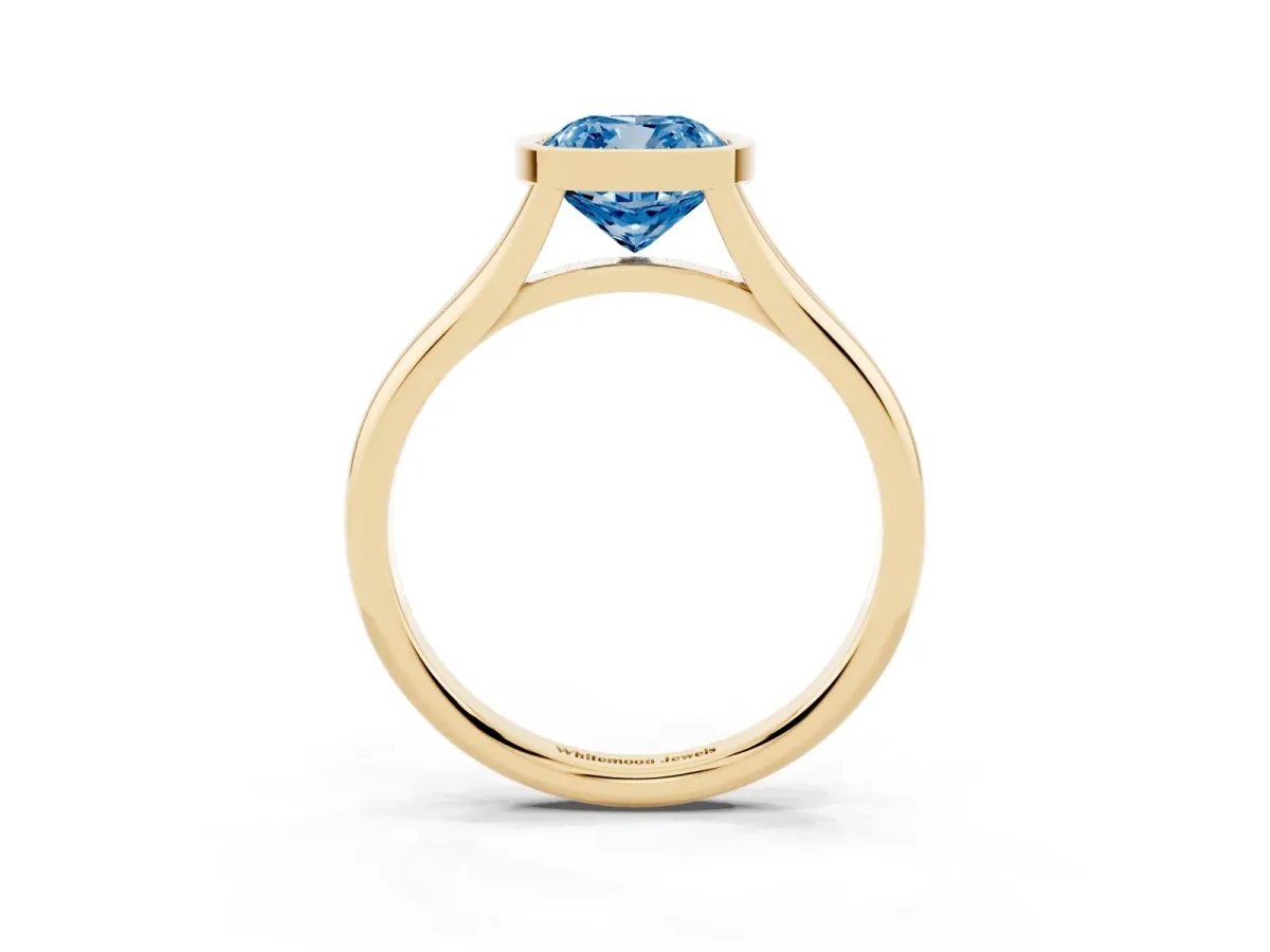 Fancy Blue Bezel Set Cushion Cut Cut Solitaire Ring with Tapered Band Yellow gold