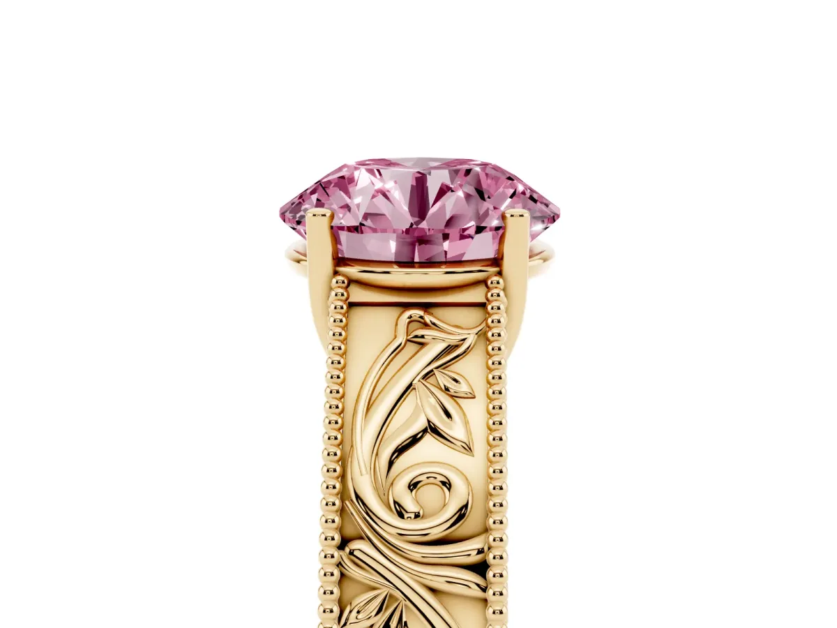 Fancy Pink Round Cut Diamond Solitaire Ring with Engraved Band and Four-Prong Setting Yellow gold