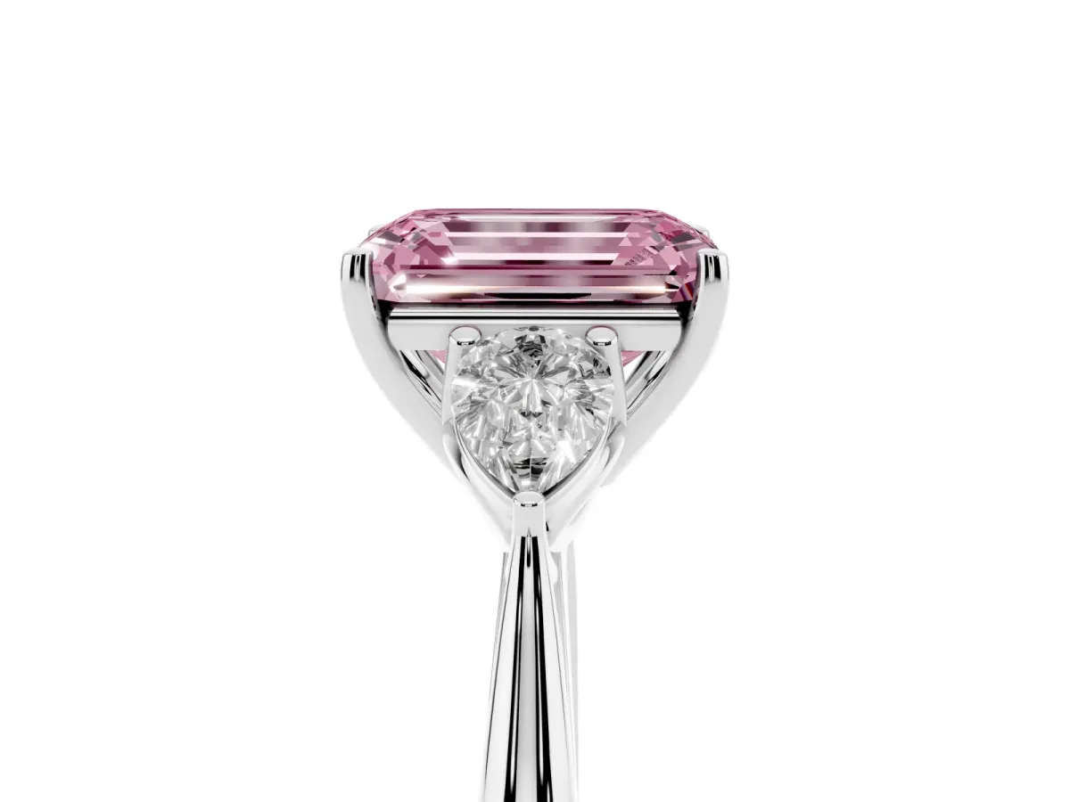 Fancy Pink Three-Stone Emerald Cut Diamond Ring with Pear Side Stones in Four-Prong Setting Platinum