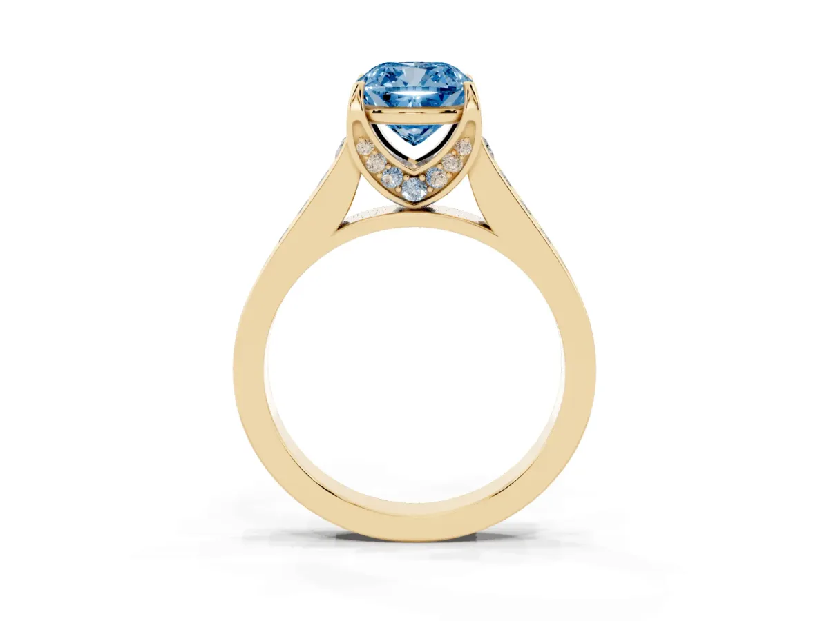 Fancy Blue Cushion Cut Brilliant Cut Diamond Engagement Ring with Pavé Band and Four-Prong Setting Yellow gold