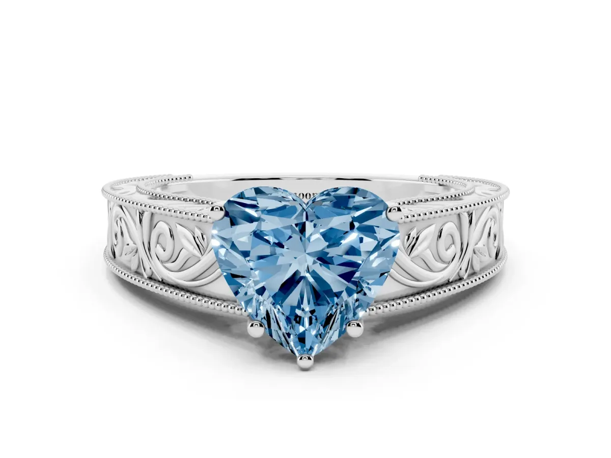 Fancy Blue Heart Cut Diamond Solitaire Ring with Engraved Band and Four-Prong Setting Silver