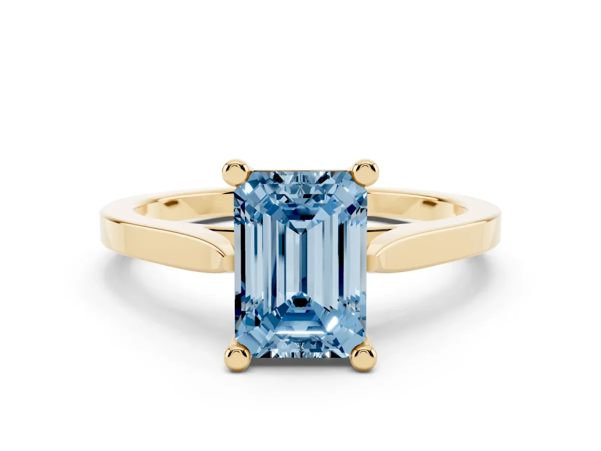 Fancy Blue Emerald Cut Solitaire Diamond Ring with Four-Prong Setting and Tapered Band Yellow gold