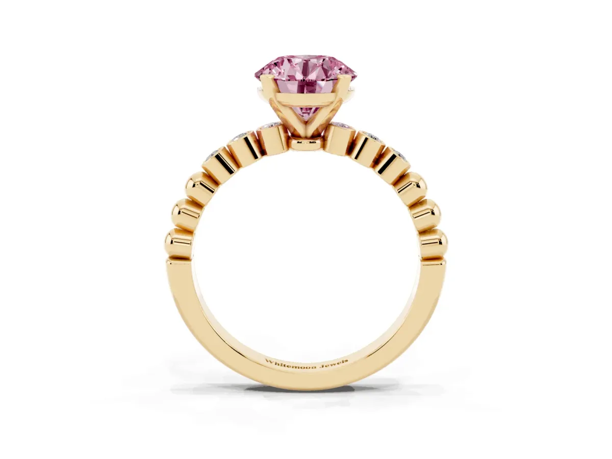 Fancy Pink Round Cut Solitaire Bezel Accent Diamond Engagement Ring with Beaded Band and Four-Prong Setting Yellow gold