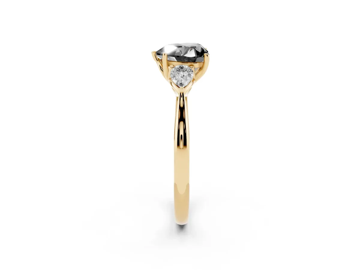 Fancy Black Three-Stone Heart Cut Brilliant Diamond Solitaire Ring with Tapered Band and Four-Prong Setting Yellow gold
