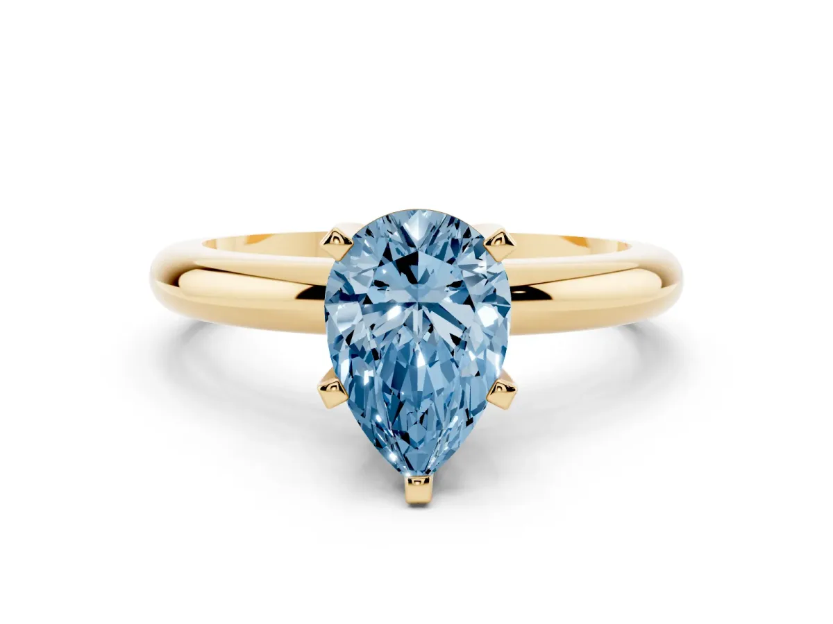 Fancy Blue Pear Cut Diamond Solitaire Engagement Ring with Round Band and Four-Prong Setting Yellow gold