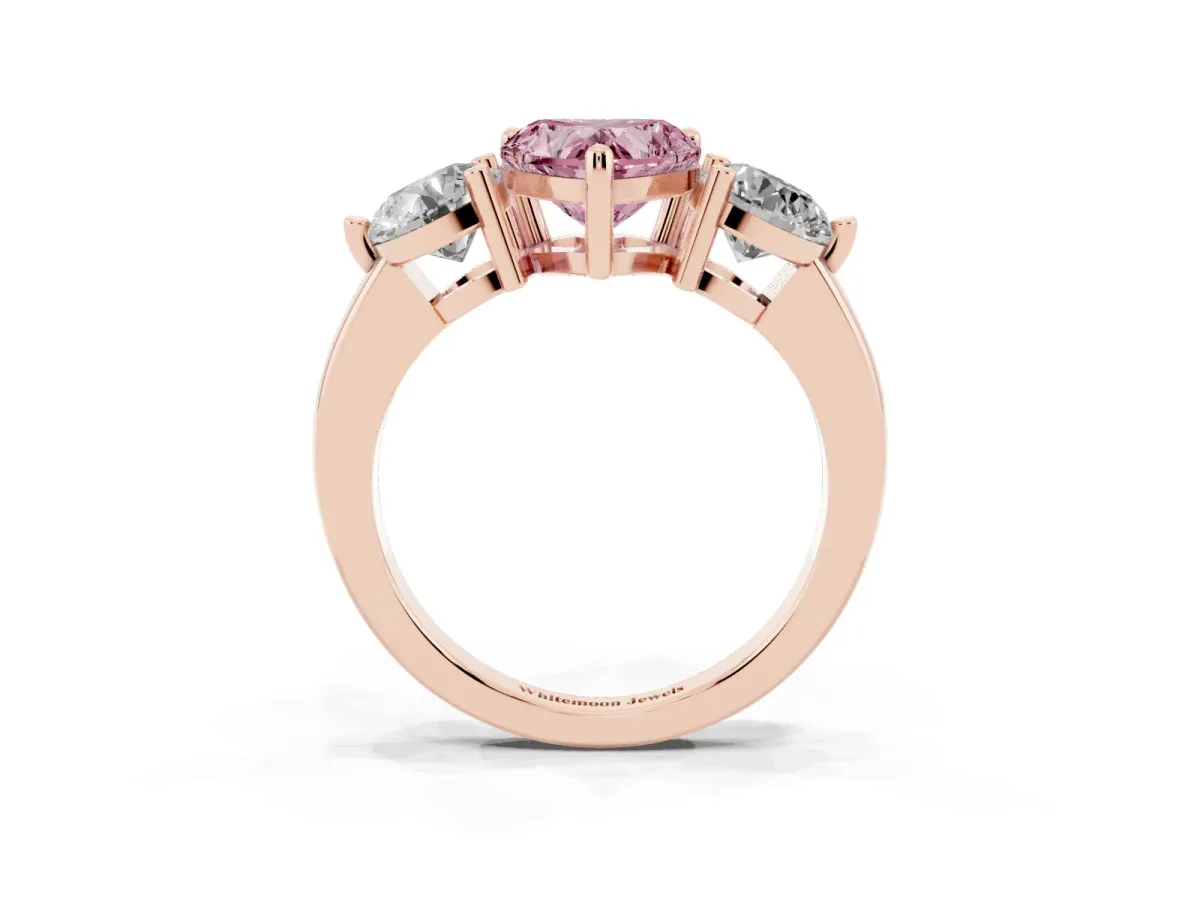 Fancy Pink Three-Stone Heart Cut Brilliant Cut Solitaire Ring with Prong Setting on a Classic Band Rose gold