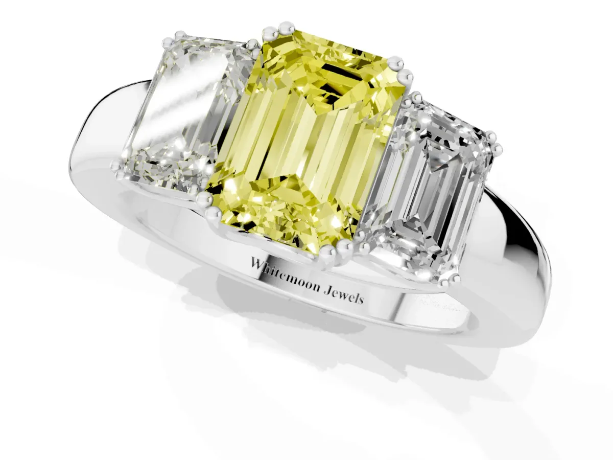 Fancy Yellow Three-Stone Emerald Cut Cut Diamond Ring with Channel Set Band and Four-Prong Setting White gold