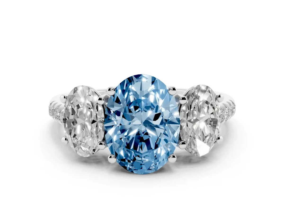Fancy Blue Three-Stone Oval Cut Diamond Ring with Round Pavé Band and Prong Setting Silver