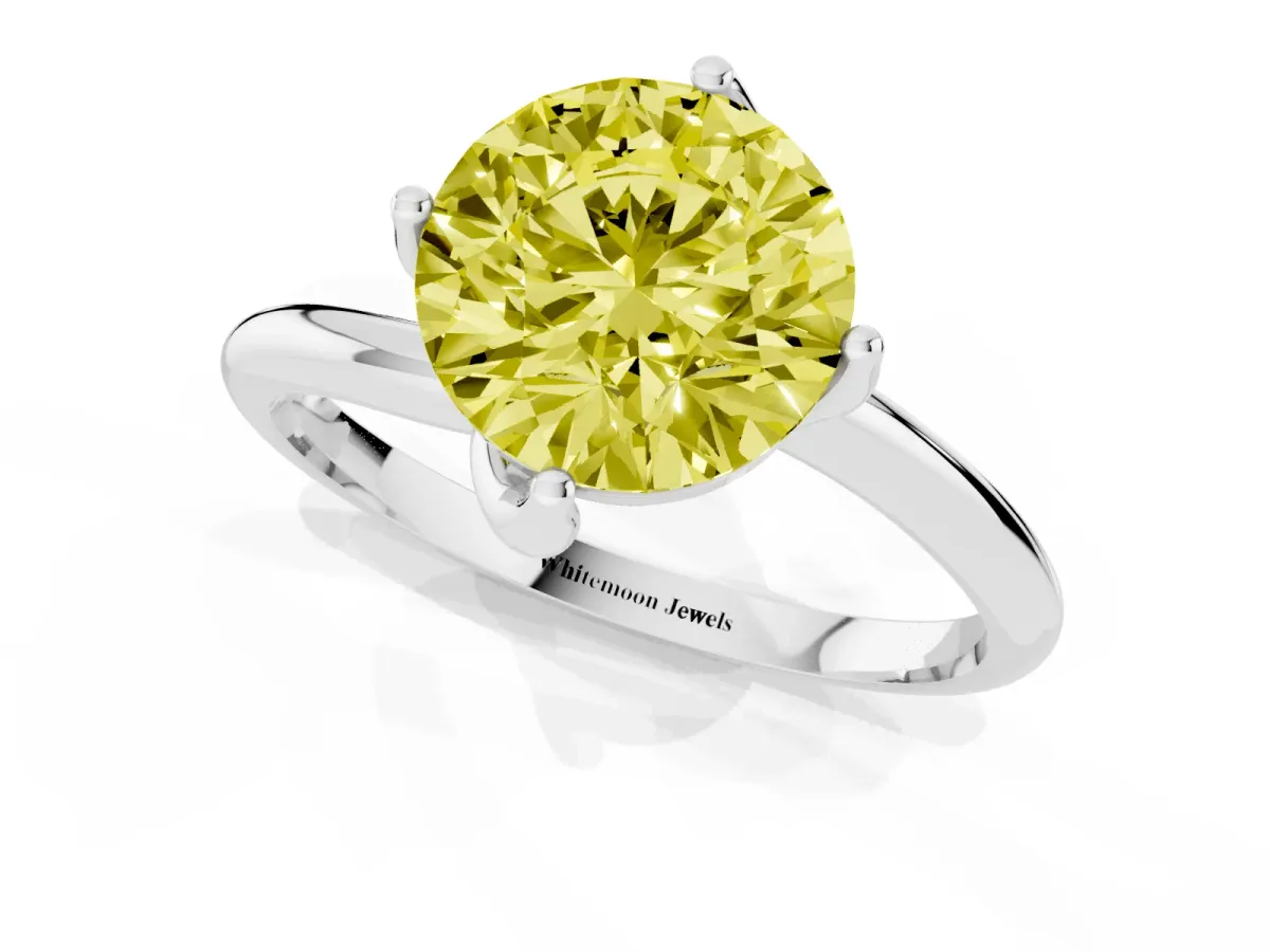 Fancy Yellow Round Cut Diamond Solitaire Engagement Ring with Four-Prong Setting and Classic Band Silver