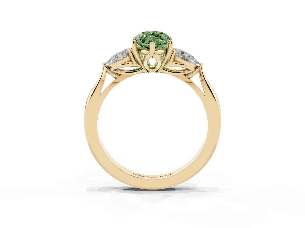 Fancy Green Three-Stone Marquise Cut Diamond Ring with Pear Side Stones in Four-Prong Setting Yellow gold