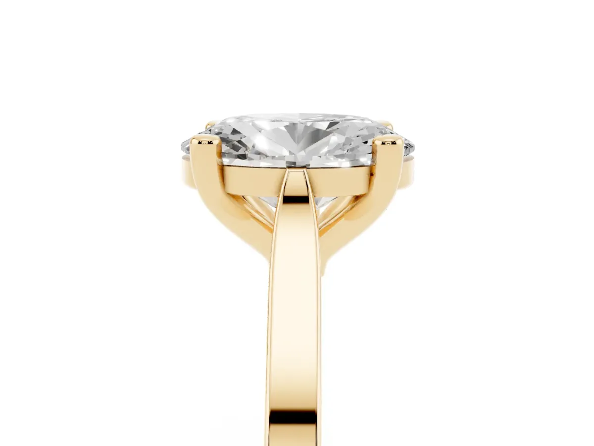 Oval Cut Solitaire Diamond Ring with Four-Prong Setting and Tapered Band Yellow gold