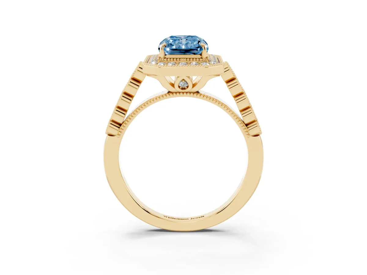 Fancy Blue Radiant Cut Halo Milgrain Solitaire with Bezel Set Side Stones and Pave Band Yellow gold