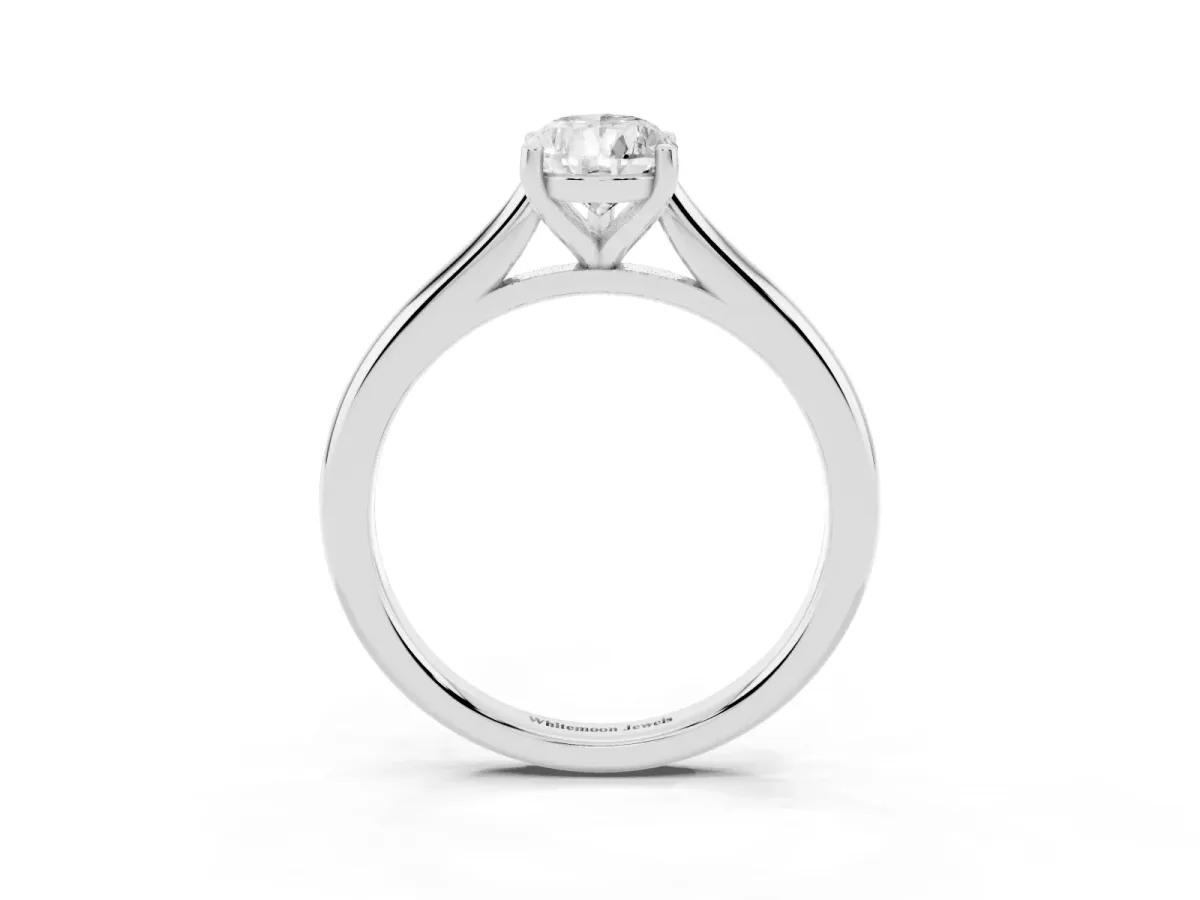 Pear Cut Cut Solitaire Ring with Cathedral Band and Four-Prong Setting Silver
