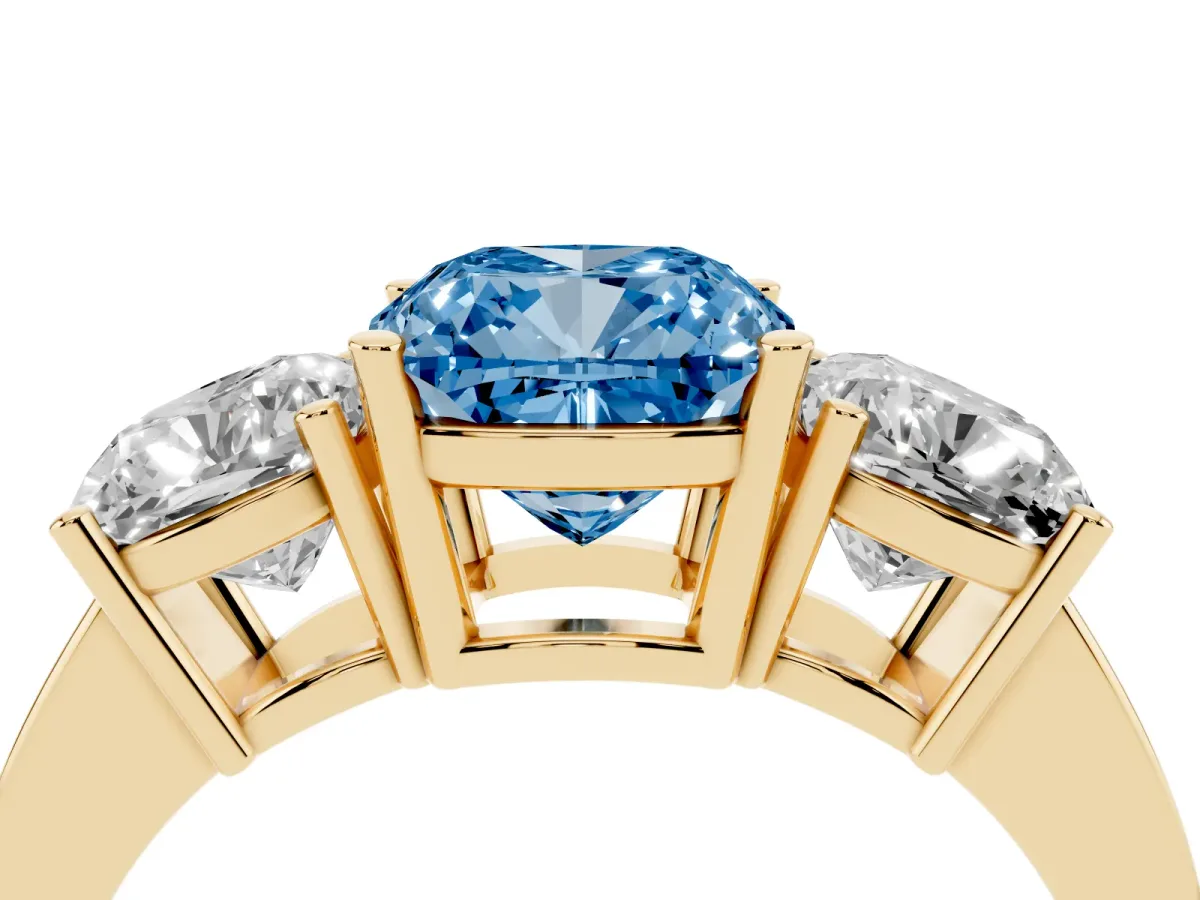 Fancy Blue Three-Stone Cushion Cut Cut Diamond Engagement Ring with Flat Band and Four-Prong Setting Yellow gold