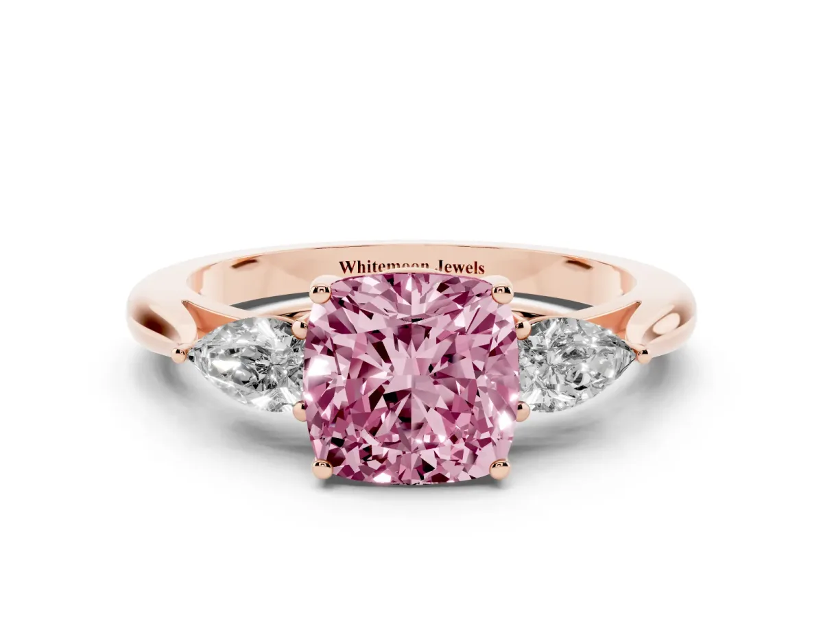 Fancy Pink Three-Stone Cushion Cut Diamond Ring with Pear Side Stones in Four-Prong Setting Rose gold