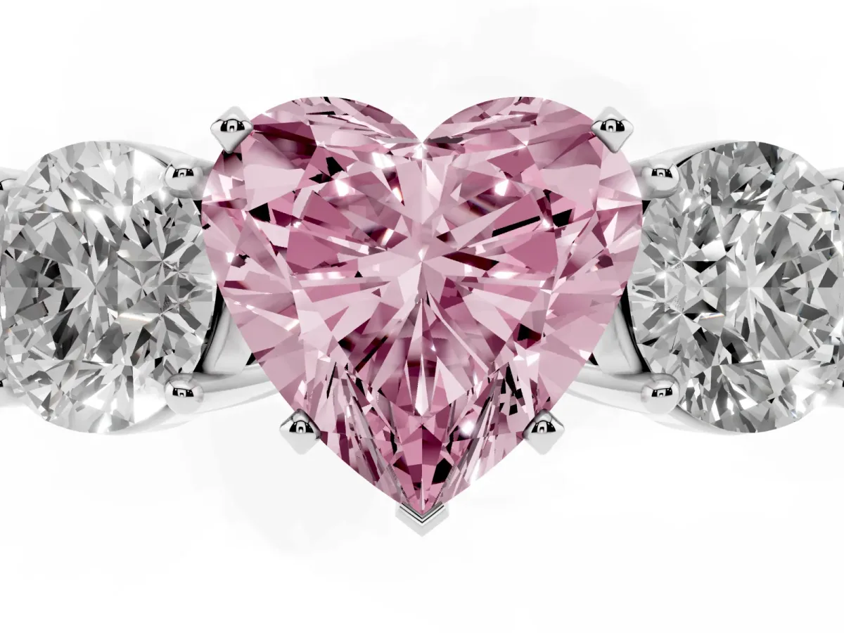 Fancy Pink Three-Stone Heart Cut Diamond Ring with Round Side Stones, Classic Band, and Four-Prong Setting Silver