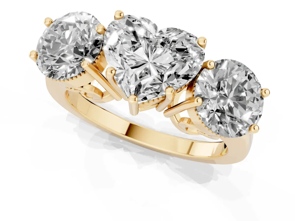 Three-Stone Heart Cut Diamond Engagement Ring with Prong Setting on a Classic Band Yellow gold