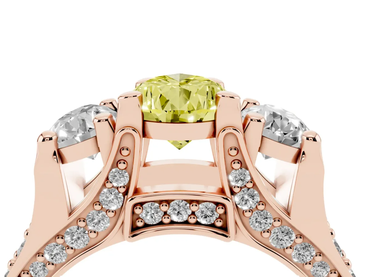 Fancy Yellow Pear Cut Diamond Three-Stone Ring with Channel Set Band and Four-Prong Setting Rose gold