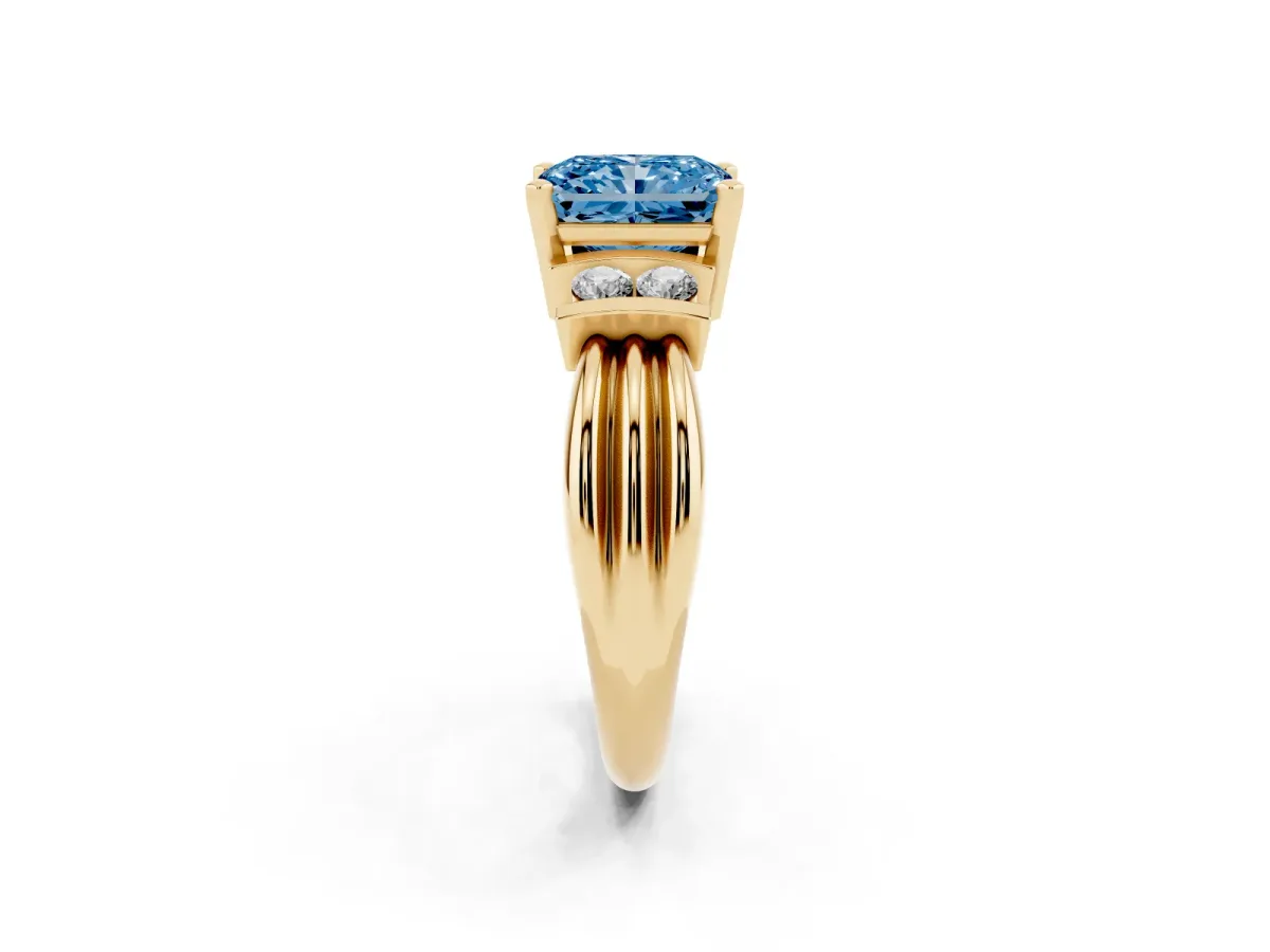 Fancy Blue Radiant Cut Cut Three-Stone Channel Set Ring with Bar Prongs Yellow gold