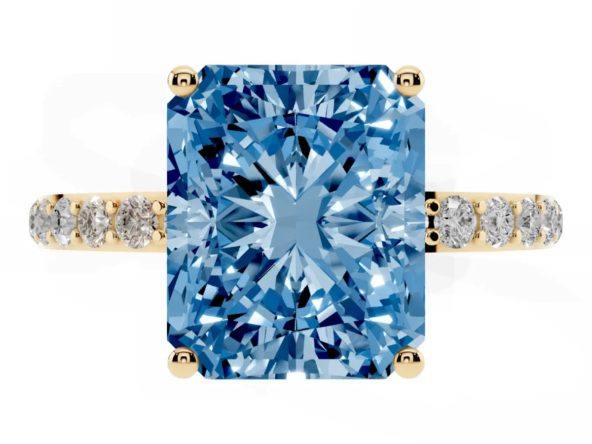 Fancy Blue Radiant Cut Diamond Solitaire Ring with Round Pavé Shoulders and Prong Setting Yellow gold