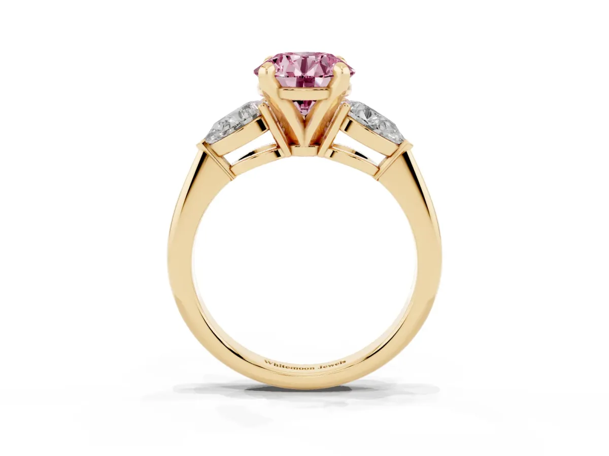 Fancy Pink Three-Stone Round Cut Diamond Ring with Pear Side Stones and Four-Prong Setting Yellow gold