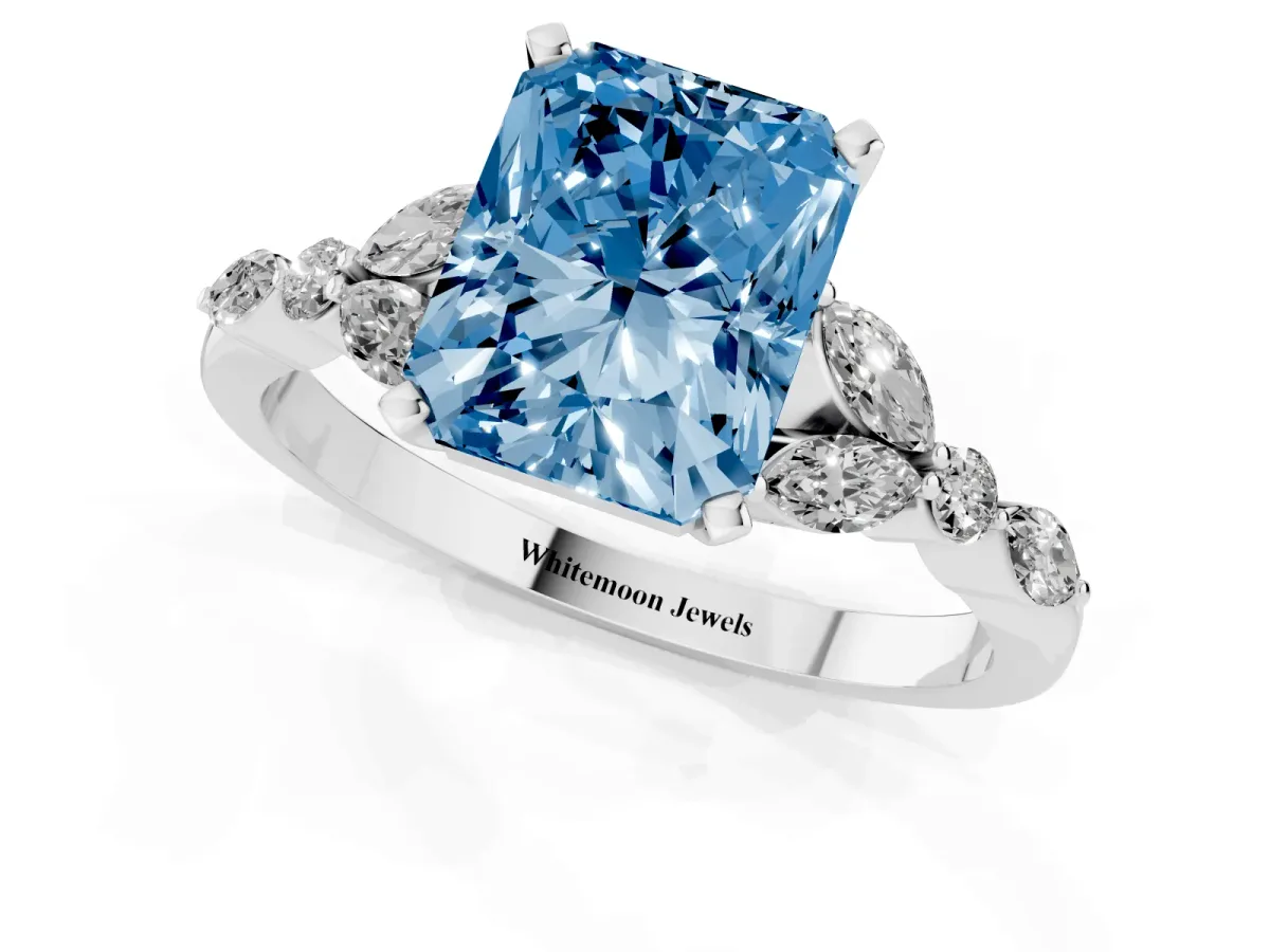 Fancy Blue Radiant Cut Diamond Solitaire Ring with Side Stones and Four-Prong Setting Platinum
