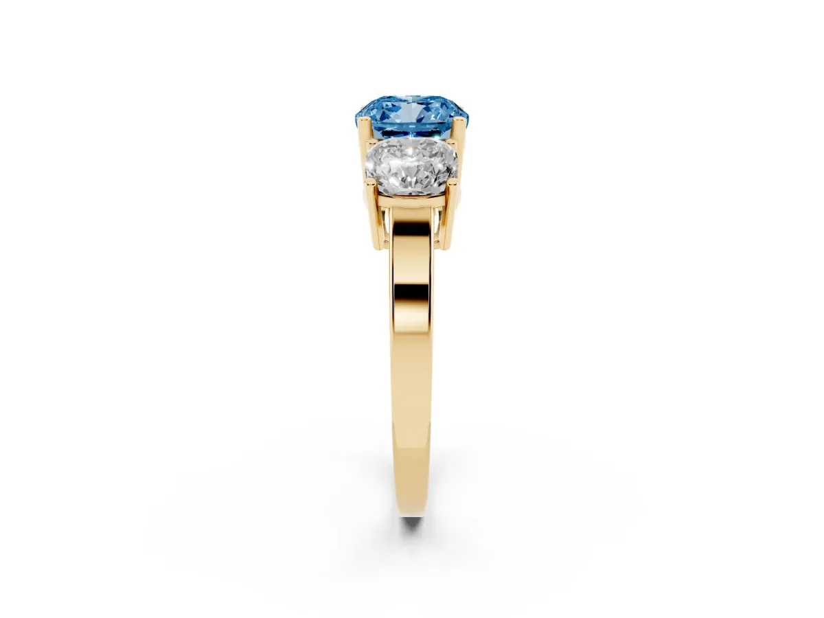 Fancy Blue Three-Stone Cushion Cut Cut Diamond Engagement Ring with Flat Band and Four-Prong Setting Yellow gold