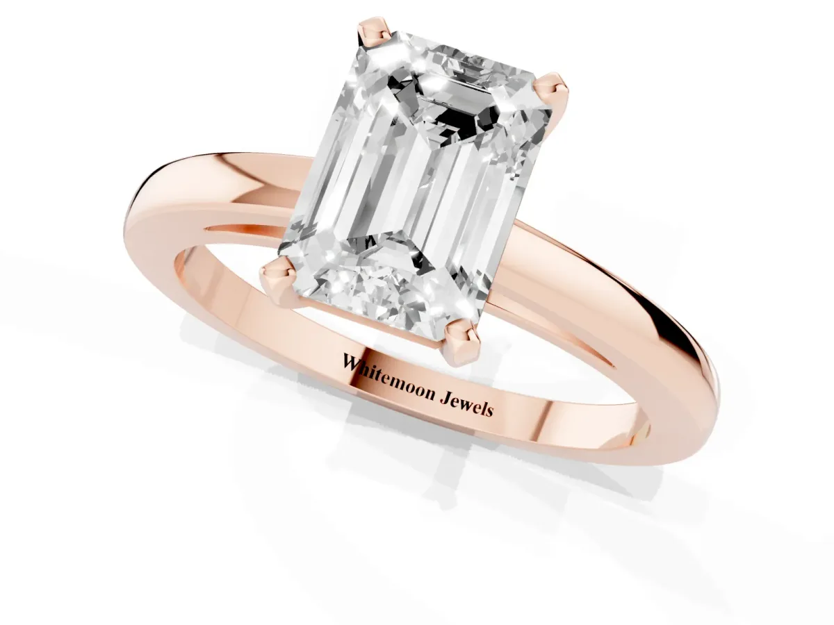 Emerald Cut Solitaire Diamond Engagement Ring with Four-Prong Setting on a Classic Band Rose gold