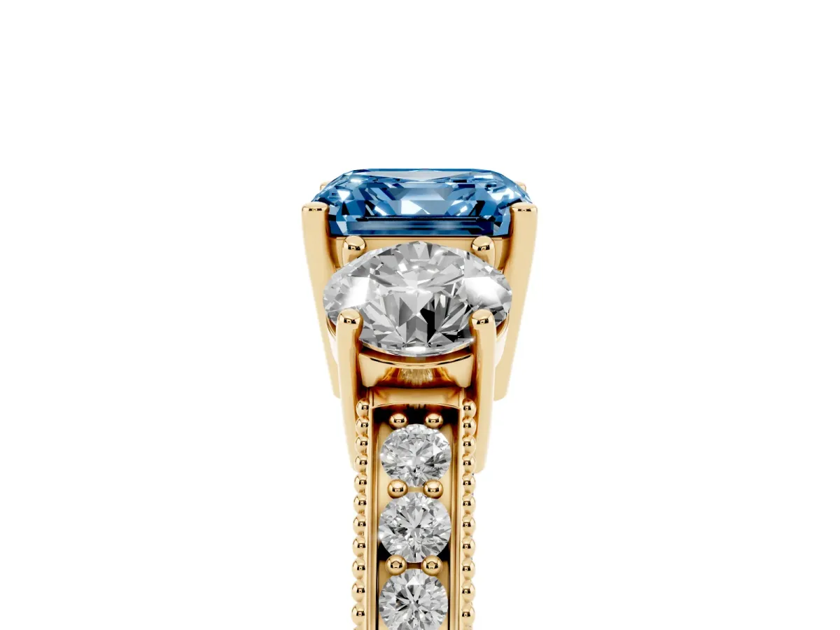 Fancy Blue Asscher Cut Three-Stone Diamond Ring with Pavé Band and Four-Prong Setting Yellow gold