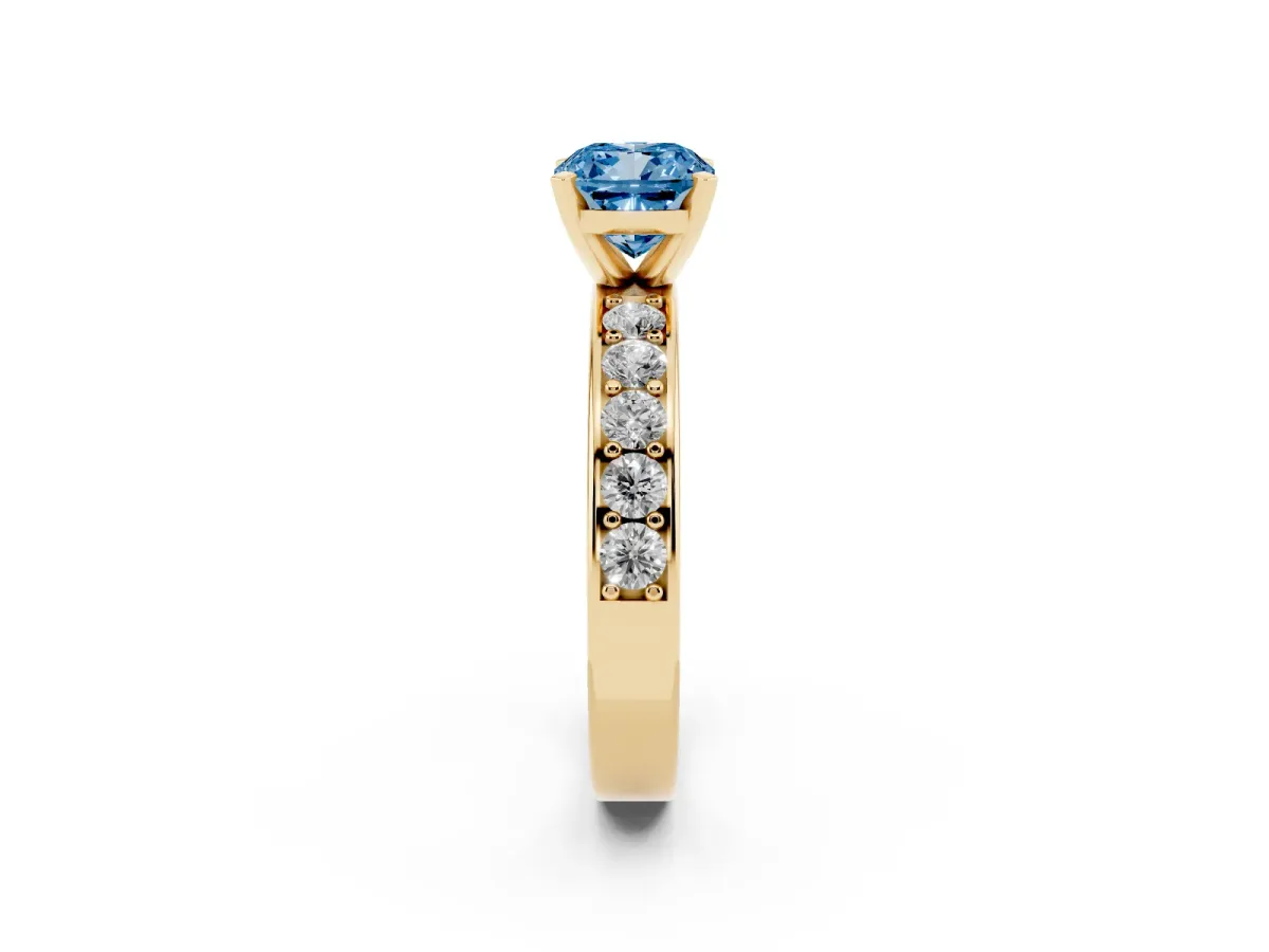 Fancy Blue Cushion Cut Diamond Engagement Ring with Channel Set Round Band and Prong Setting Yellow gold
