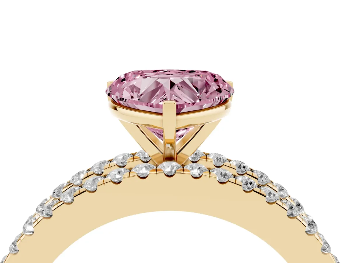 Fancy Pink Heart Cut Diamond Solitaire Ring with Pavé and Channel Set Band Yellow gold