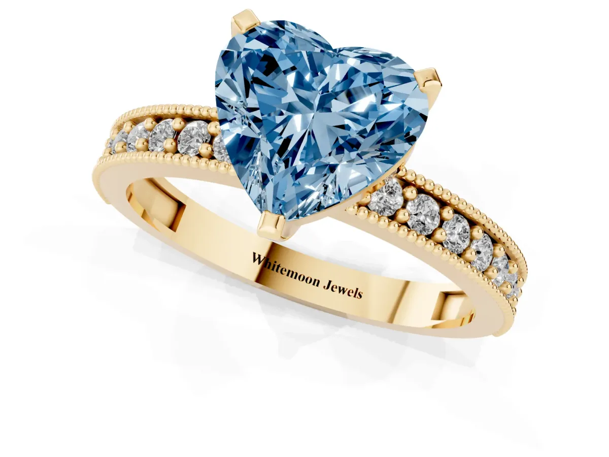 Fancy Blue Heart Cut Diamond Milgrain Pavé Engagement Ring with Four-Prong Setting Yellow gold