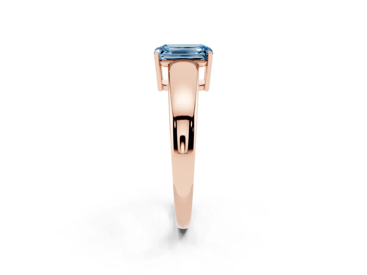 Fancy Blue Emerald Cut Solitaire Diamond Ring with Tapered Band and Four-Prong Setting Rose gold