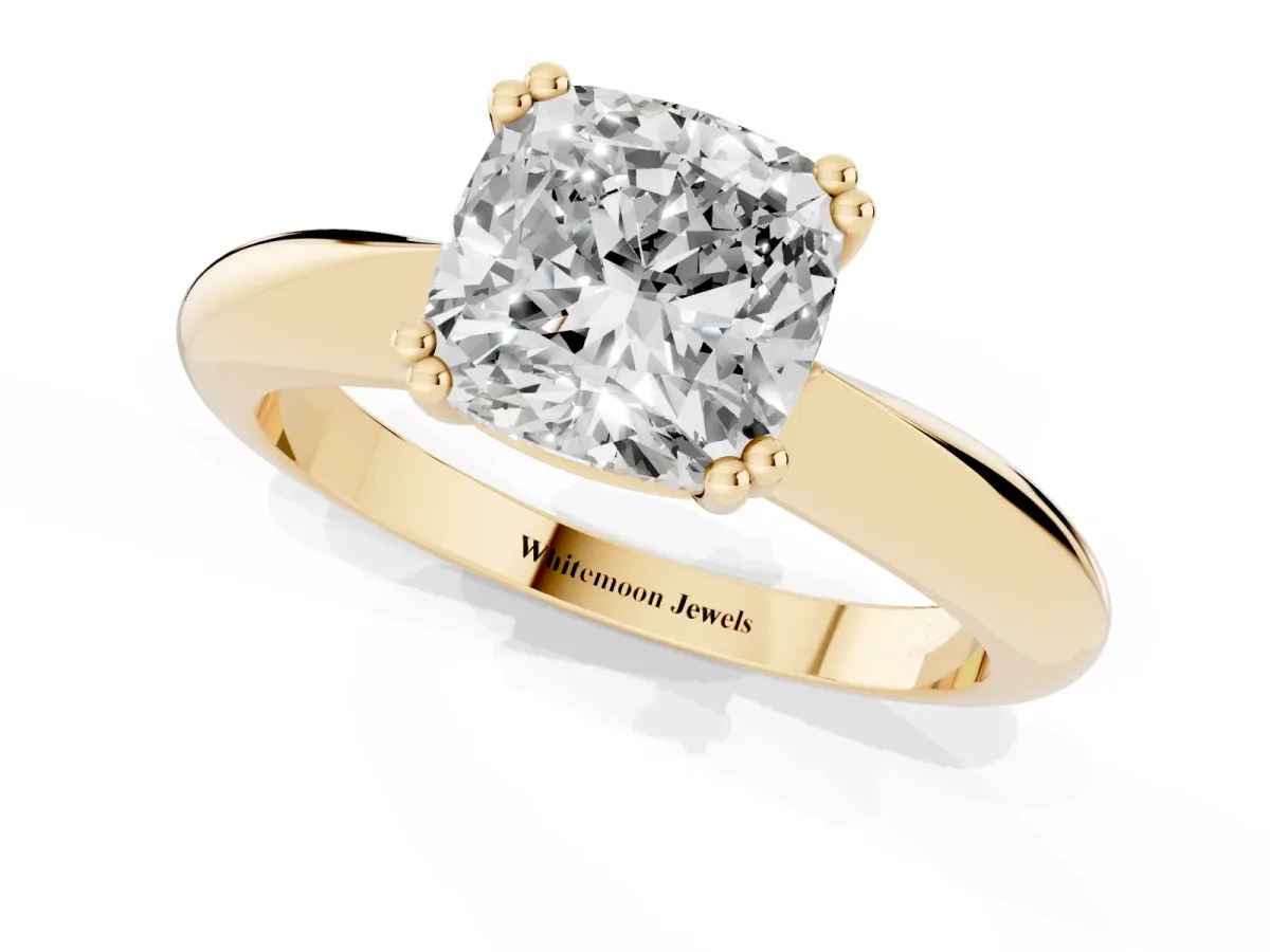 Cushion Cut Cut Solitaire Engagement Ring with Tapered Band and Four-Prong Setting Yellow gold