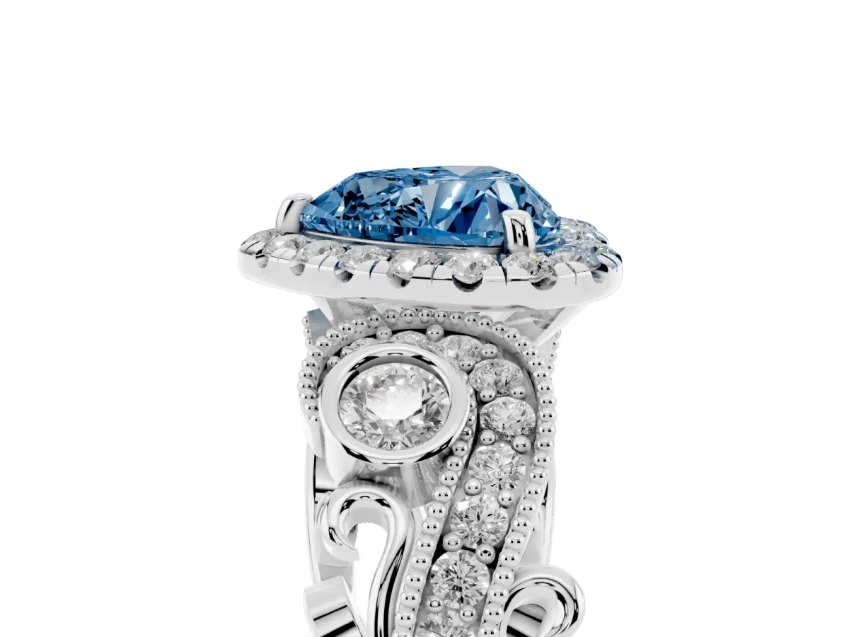 Fancy Blue Heart Cut Halo Diamond Ring with Milgrain and Bezel Accents on a Split Shank Band Platinum