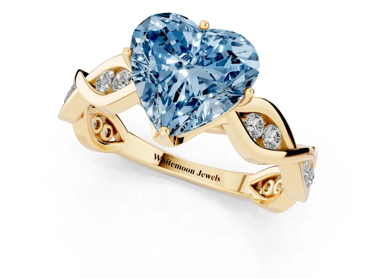 Fancy Blue Heart Cut Solitaire Twist Band with Leaf Prong Setting Yellow gold