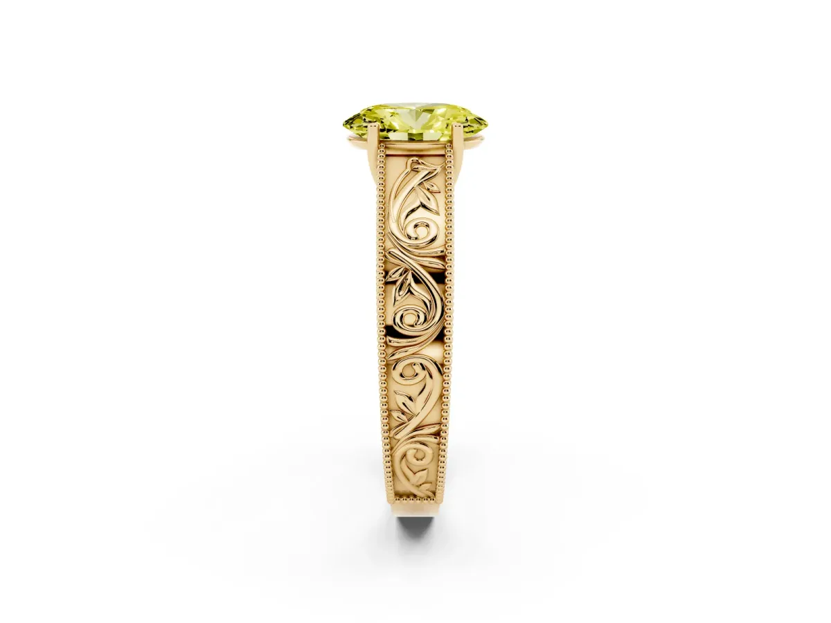 Fancy Yellow Oval Cut Diamond Solitaire Ring with Engraved Band and Four-Prong Setting Yellow gold