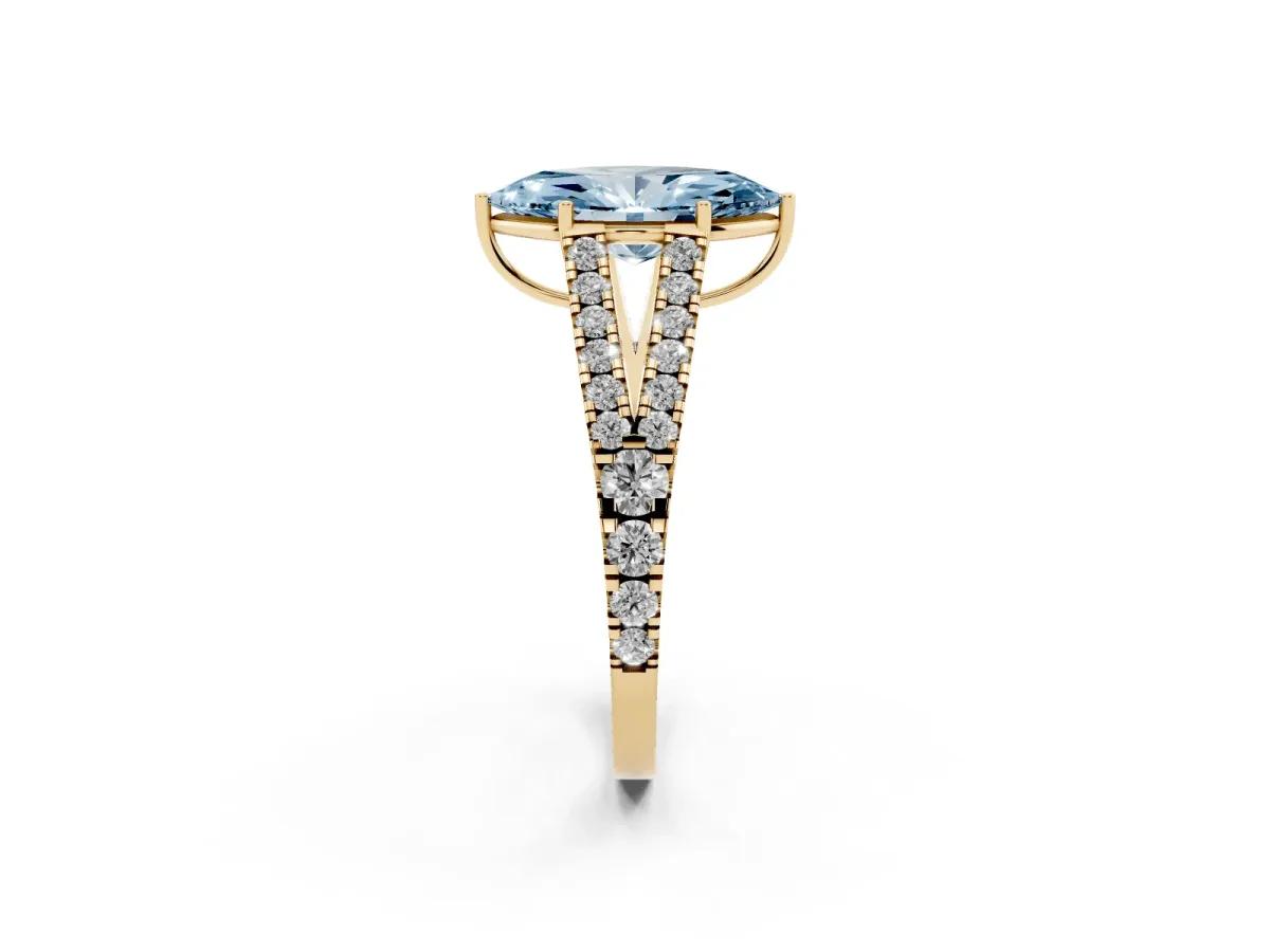 Fancy Blue Marquise Cut Diamond Split Shank Pavé Engagement Ring with Four-Prong Setting Yellow gold